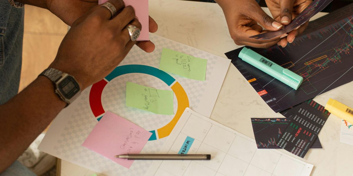 A diverse team collaborating around a table, actively making strategic decisions for their company's future.