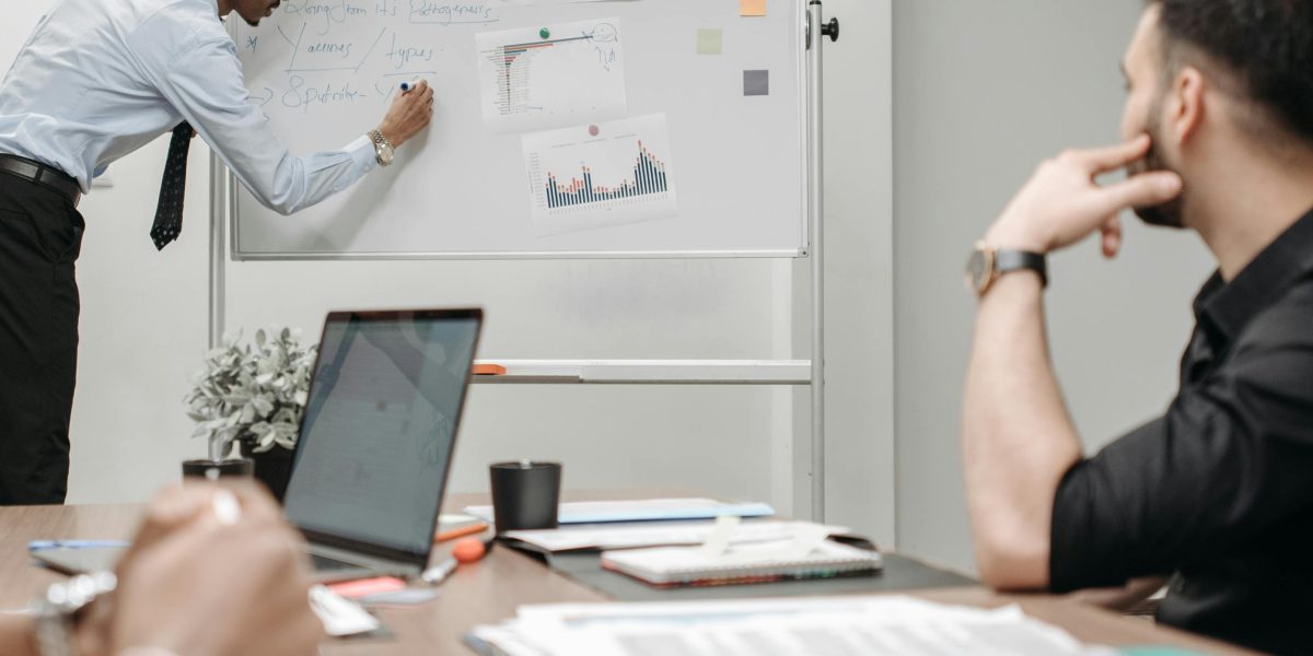 A diverse team actively collaborating to solve complex business challenges, reflecting KKR's operational support.