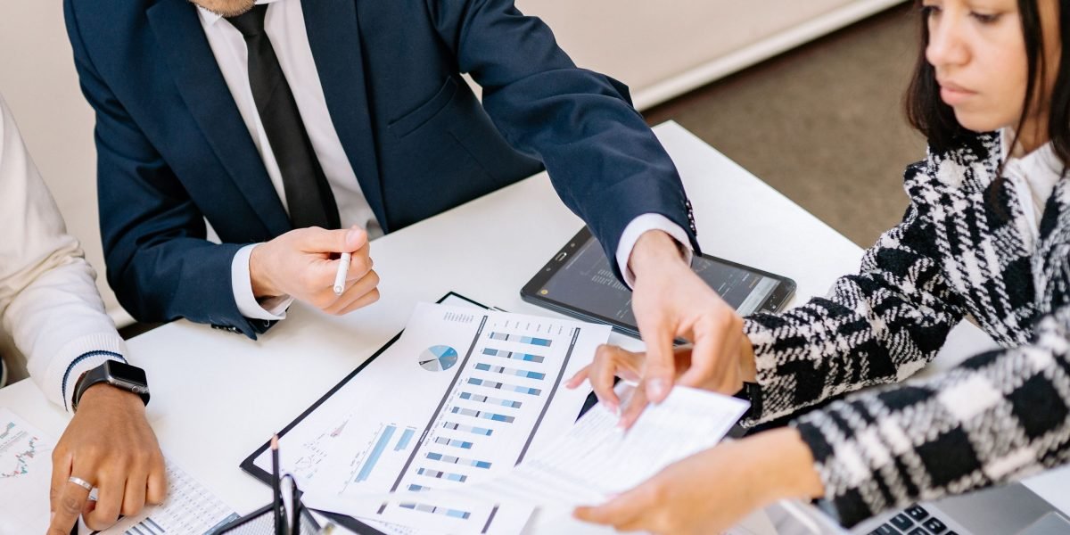 A team collaboratively analyzing data helps streamline fundraising efforts and improve strategy.