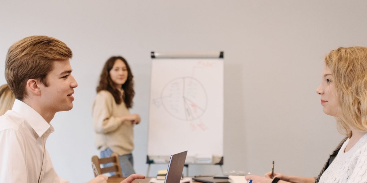 A team of professionals engaged in a strategic discussion, reflecting the complex world of private equity.