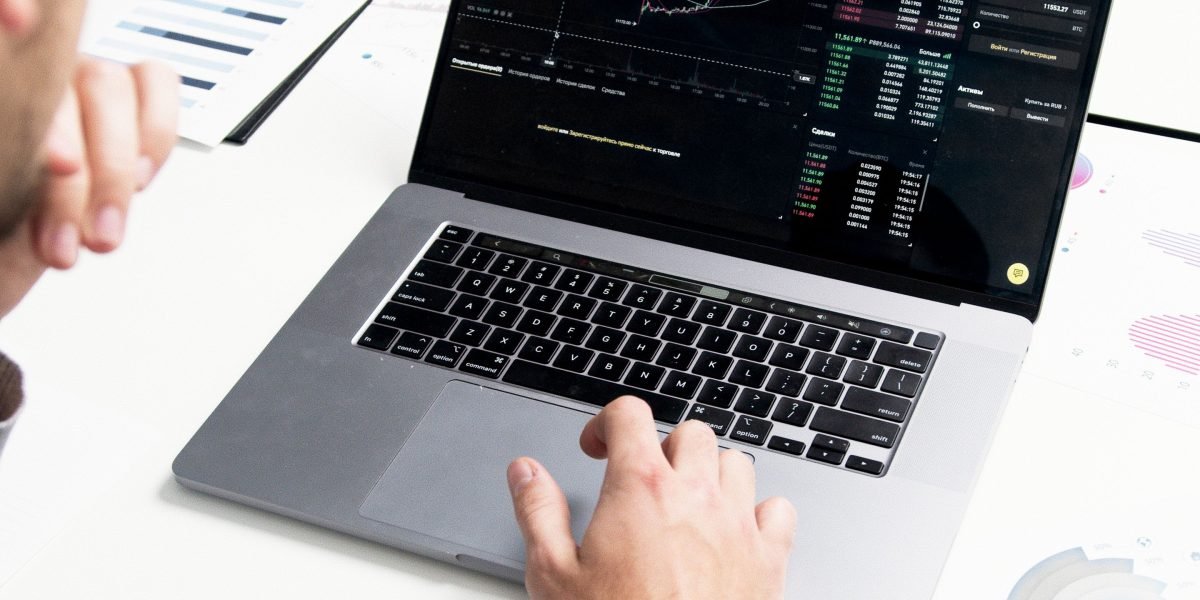 An individual strategically planning their investment portfolio, considering diversification.