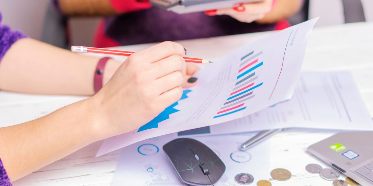 A team collaboratively analyzing financial data, symbolizing the complex and multi-faceted nature of large-scale investment platforms.