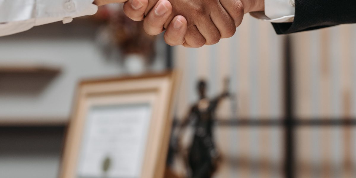 Two business professionals shaking hands, symbolizing a strong partnership and trust built through careful evaluation.