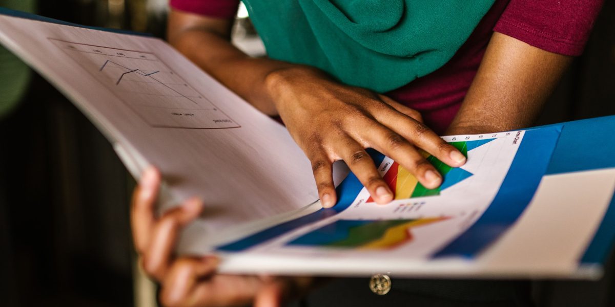 An entrepreneur thoughtfully reviewing various options and pathways, symbolizing the complex decision-making involved in securing private equity.