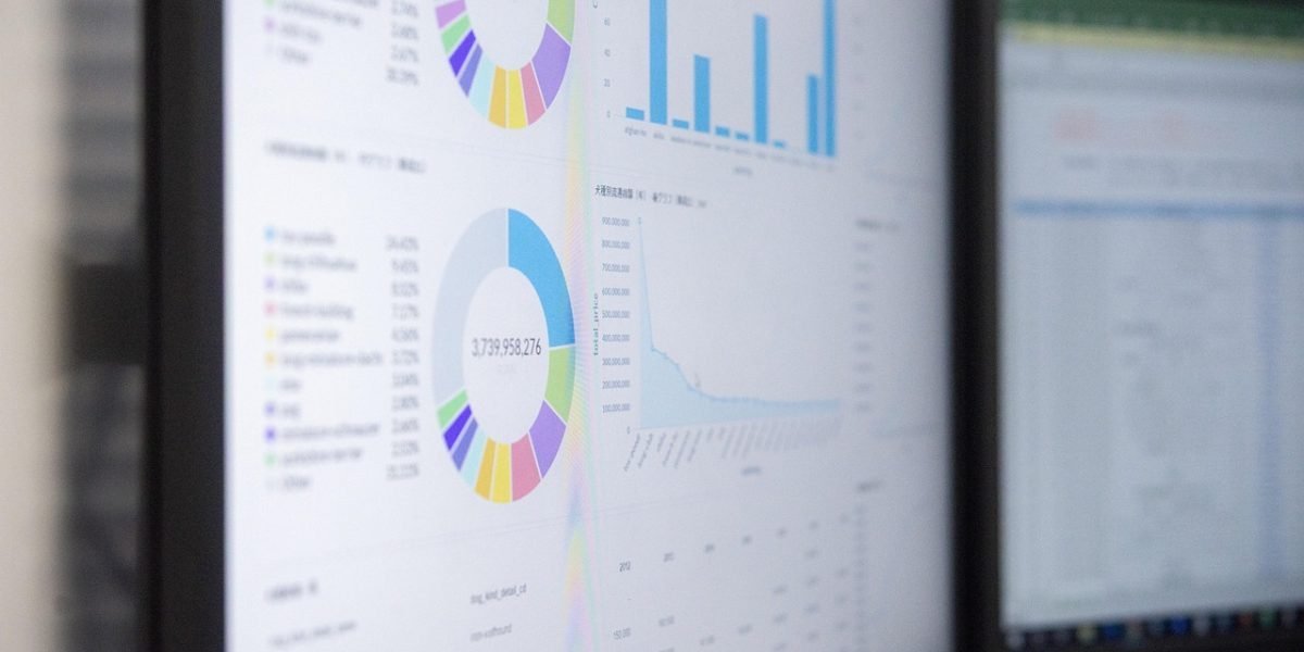 A focused professional reviewing complex financial documents, reflecting on market pressures.