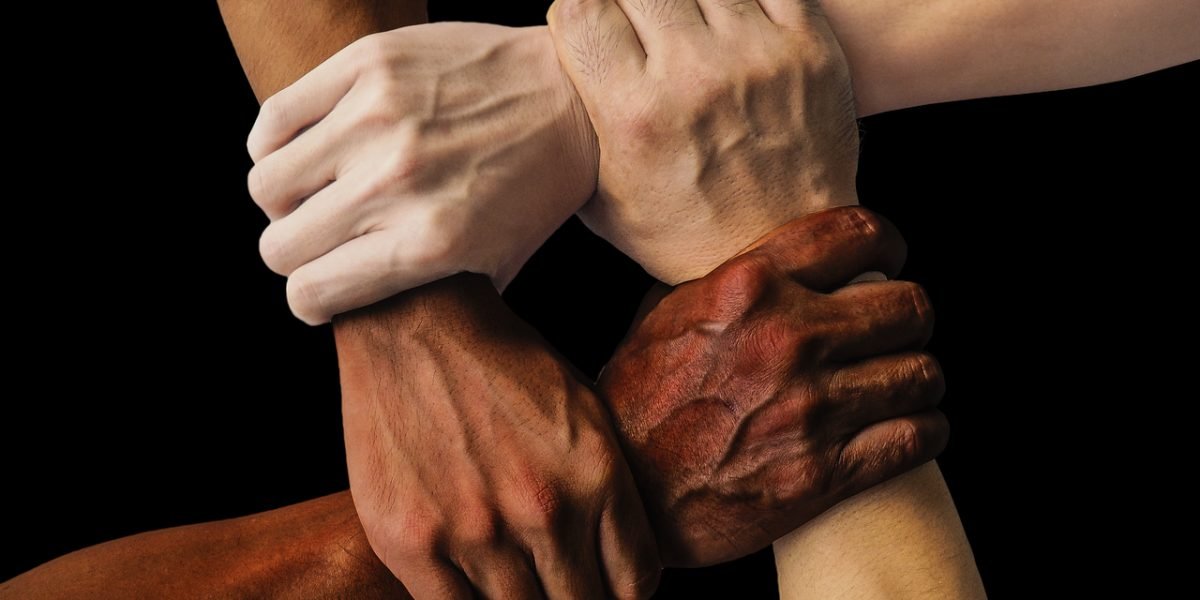 A diverse team actively collaborating on a complex project, embodying public-private partnership innovation.