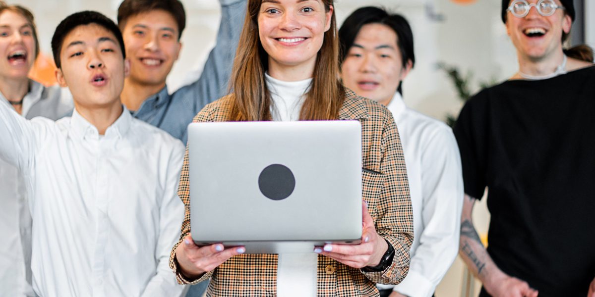A startup team celebrates a significant milestone or achievement, reflecting the positive outcomes of their hard work and program engagement.