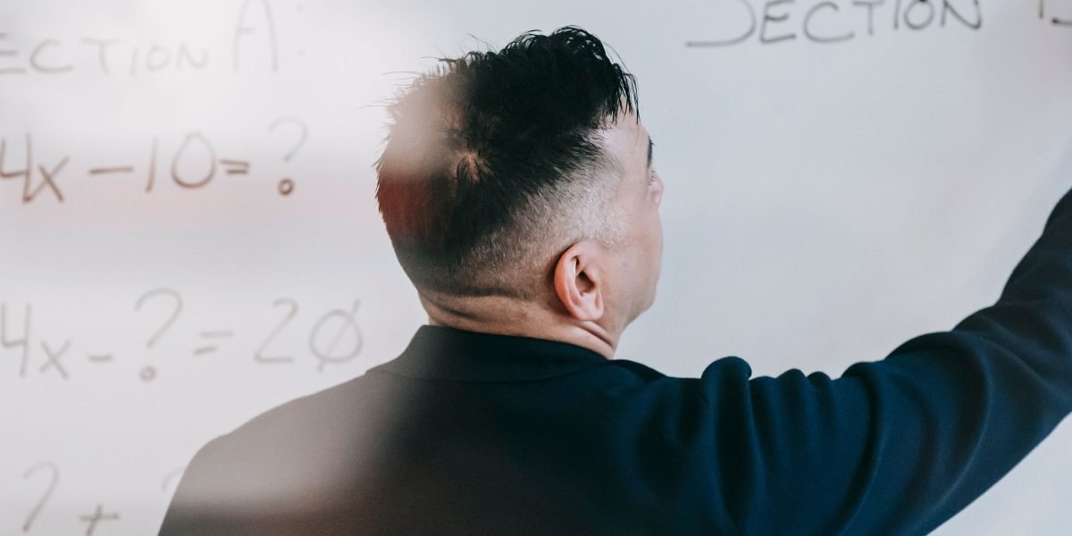 An individual deeply engaged in learning complex business concepts and investor profiles.