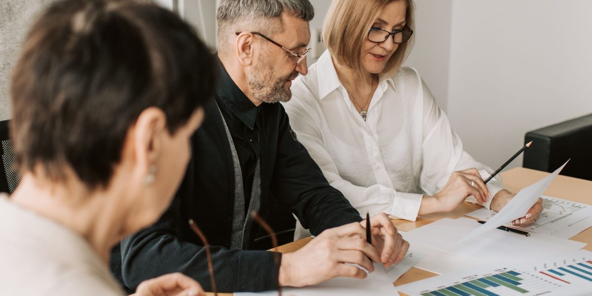 A diverse team working together to develop a smart fundraising strategy.