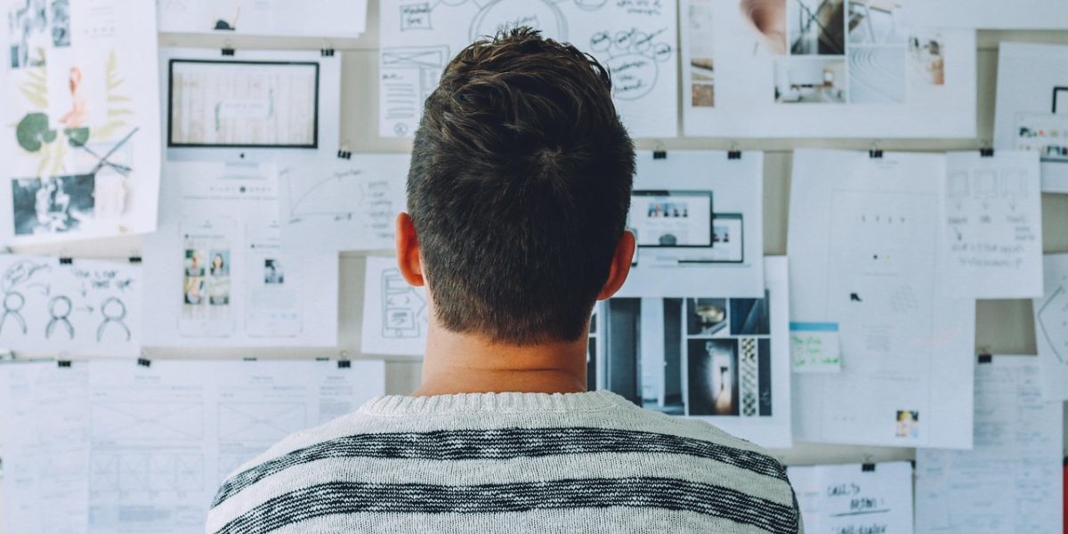 A group of diverse individuals actively brainstorming and collaborating on innovative ideas.
