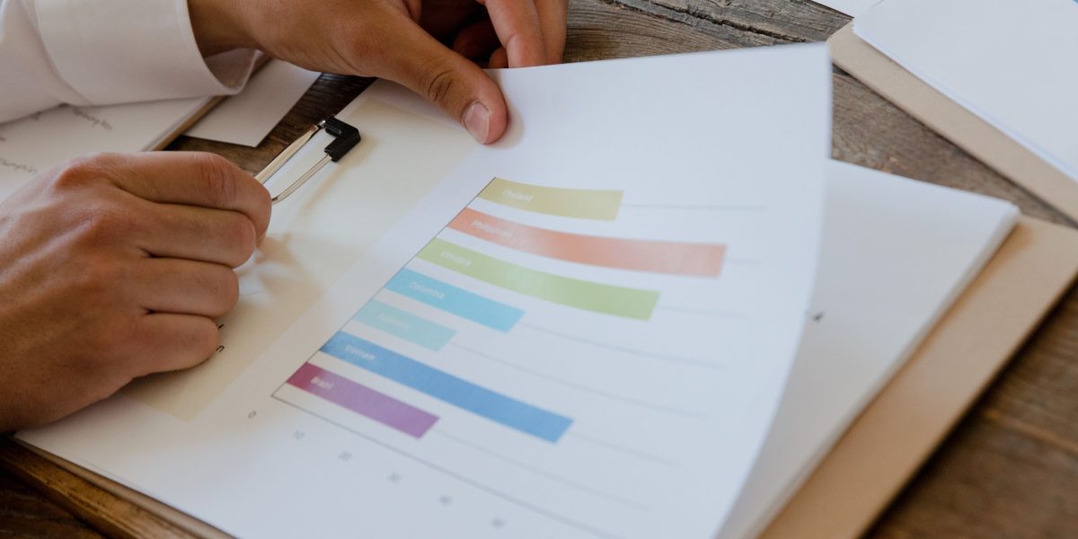A business owner carefully reviewing documents and regulations for market entry.