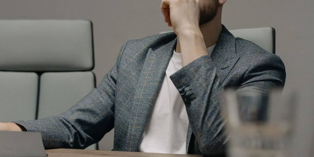 A business leader making a thoughtful decision, symbolizing the critical process of signal prioritization in investments.