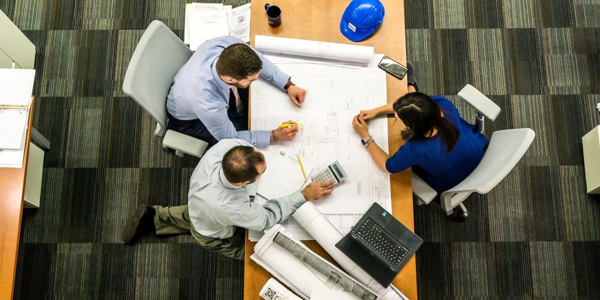A diverse team collaborating intensely, developing strategies to boost revenue and improve unit economics for growth.
