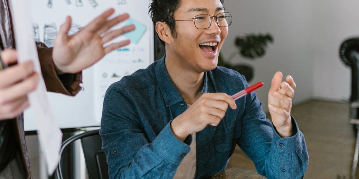 A confident founder standing in front of a small group of investors, passionately presenting their business idea and vision.