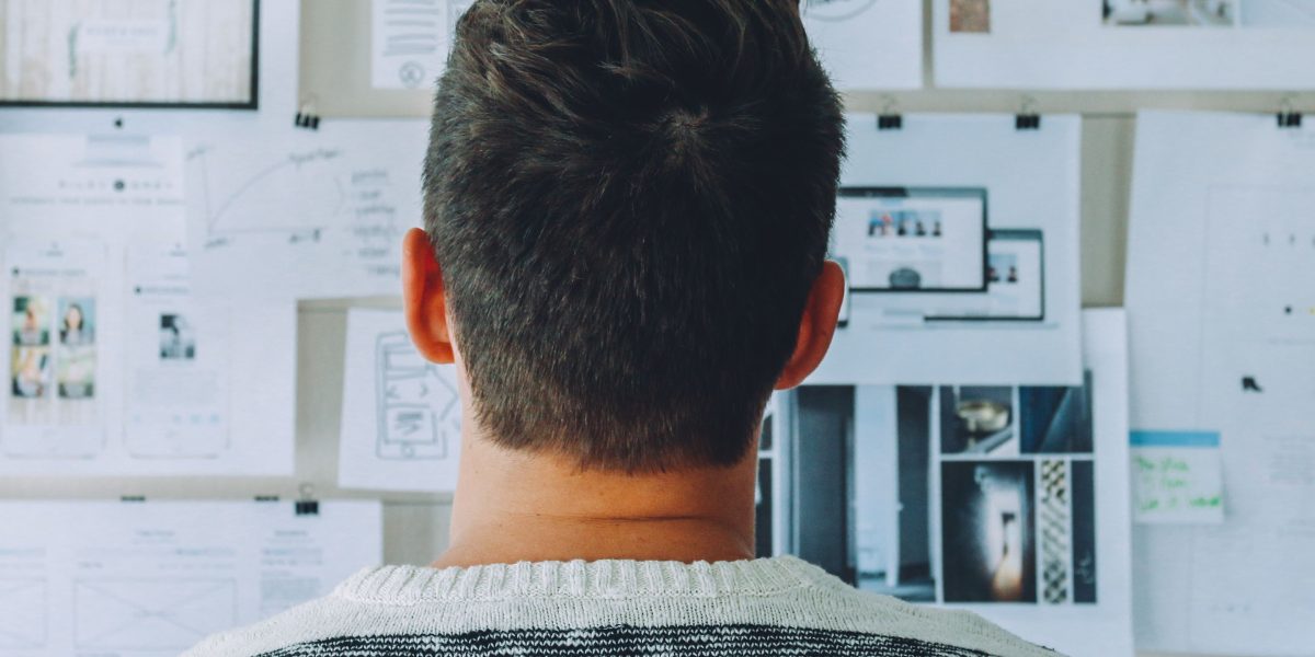 An individual contemplating complex financial decisions, reflecting the maze-like nature of startup fundraising.
