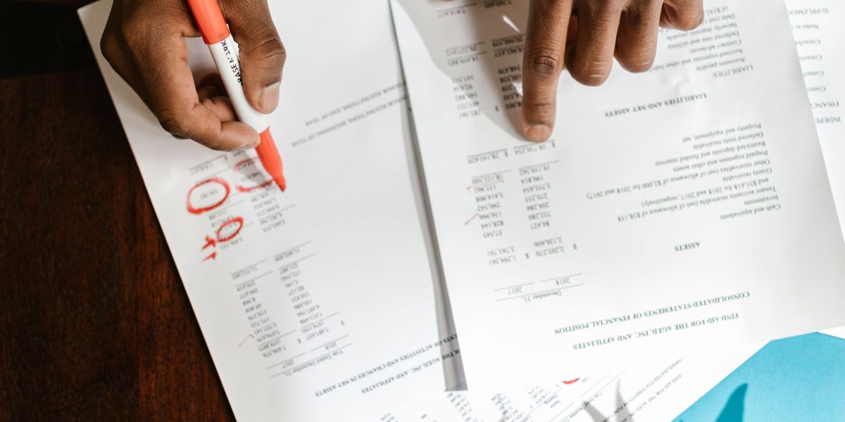 An investor deeply focused on analyzing financial reports, symbolizing the careful decision-making in private equity.
