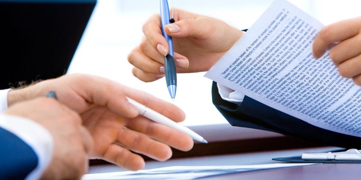 A founder meticulously organizing financial records and business plans, preparing for the intensive due diligence phase with potential investors.