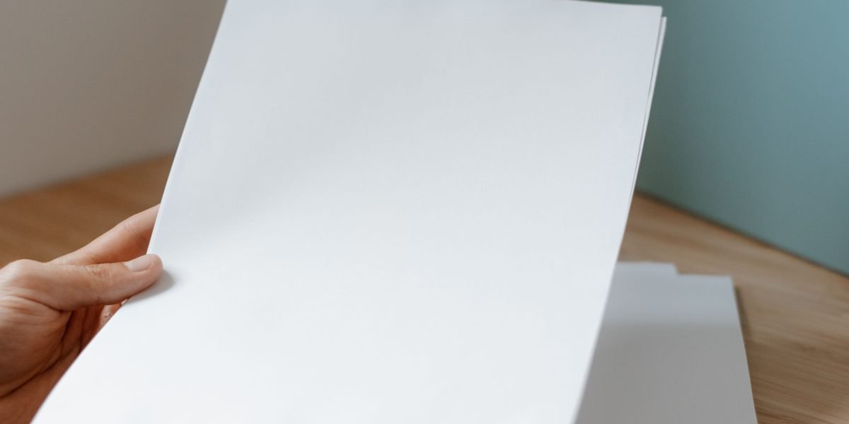 A founder meticulously organizes documents for a comprehensive funding package.