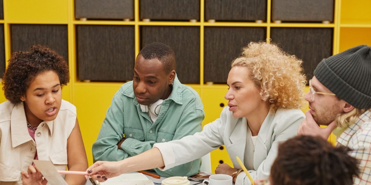 A team in a meeting, diligently evaluating potential investor partnerships and alignment.