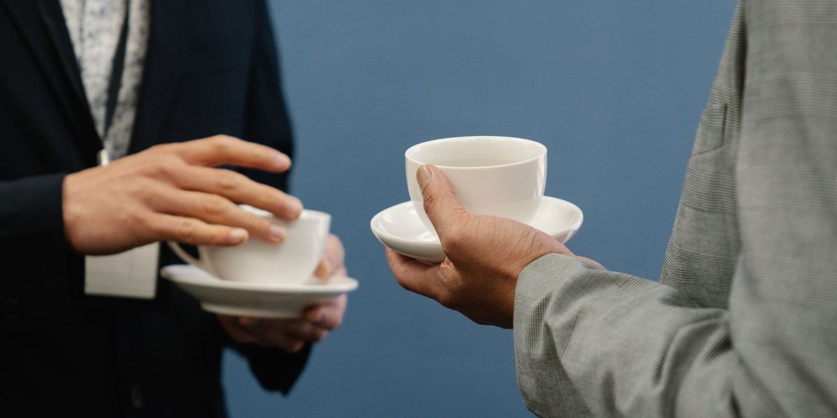 Professionals engage in conversation and networking at a vibrant industry event.