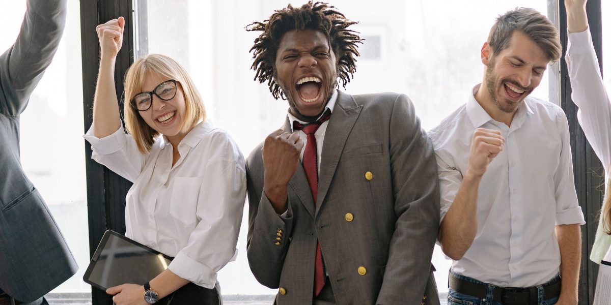 A team of entrepreneurs celebrating a successful funding round or business milestone.