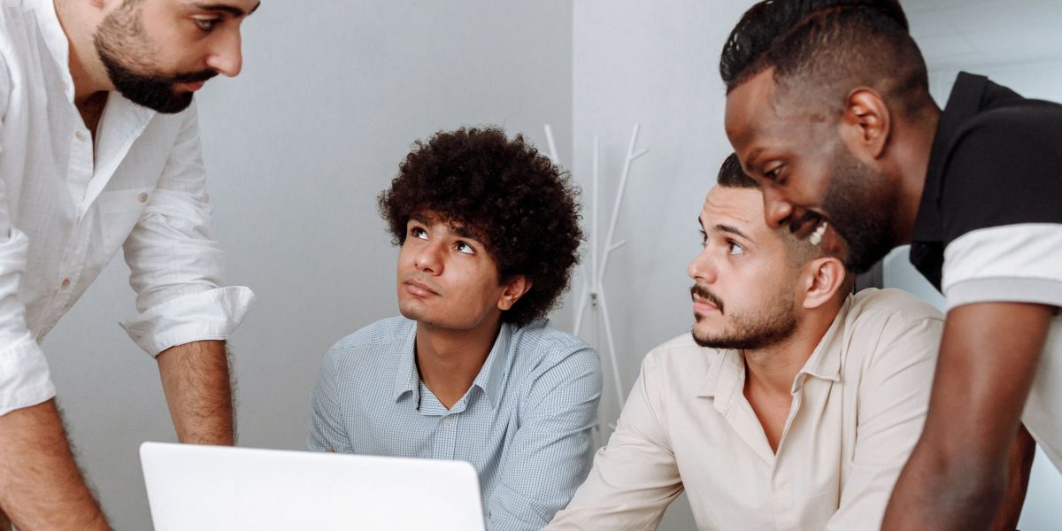 Entrepreneurs collaborate, symbolizing the blend of capital and guidance offered by excelerate funding programs.