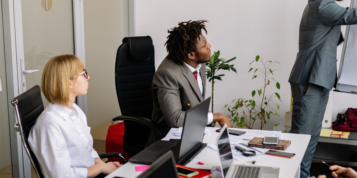 A business professional confidently presents ideas, reflecting the importance of a strong pitch for excelerate funding.