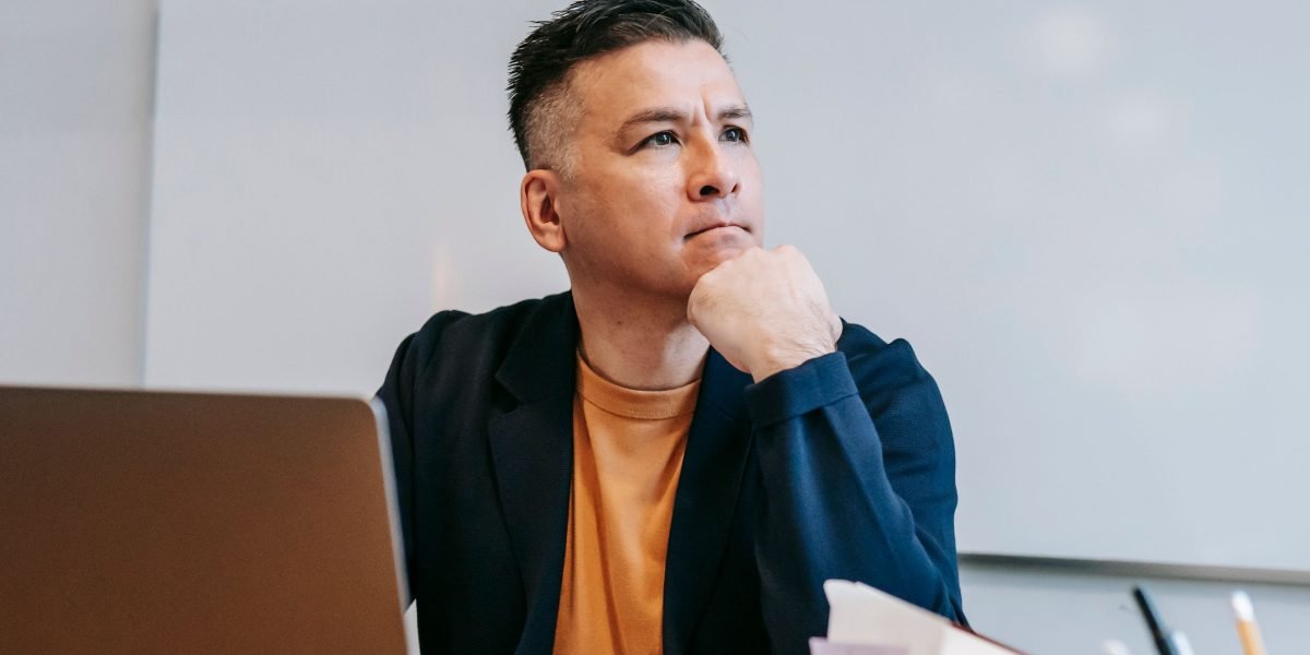 A person deeply focused on making strategic decisions, reflecting the importance of informed choices in fundraising.