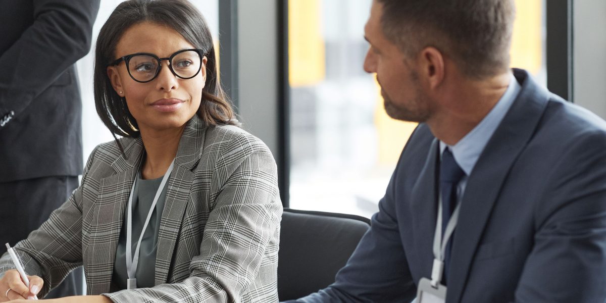 Founders and investors engage in discussion over a term sheet, outlining investment terms.