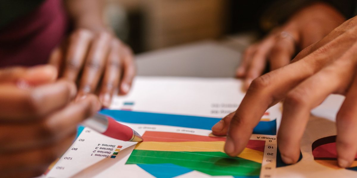 A team actively discussing market trends and opportunities, reflecting the analysis needed to identify where early-stage deals are forming.