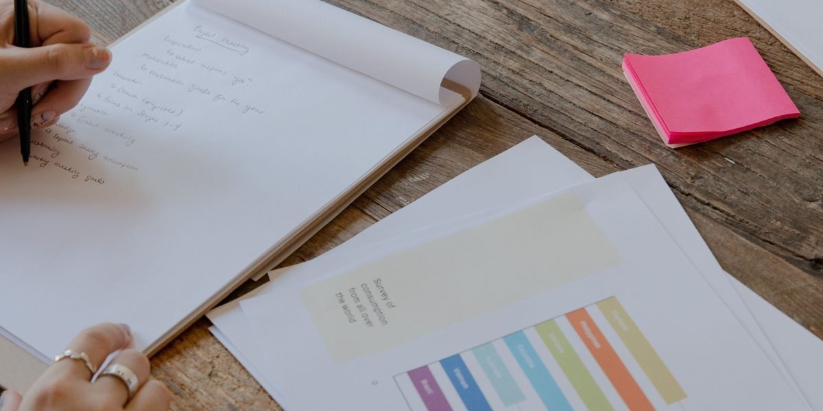 A startup founder diligently preparing documents and a presentation, embodying the readiness required to attract investors.