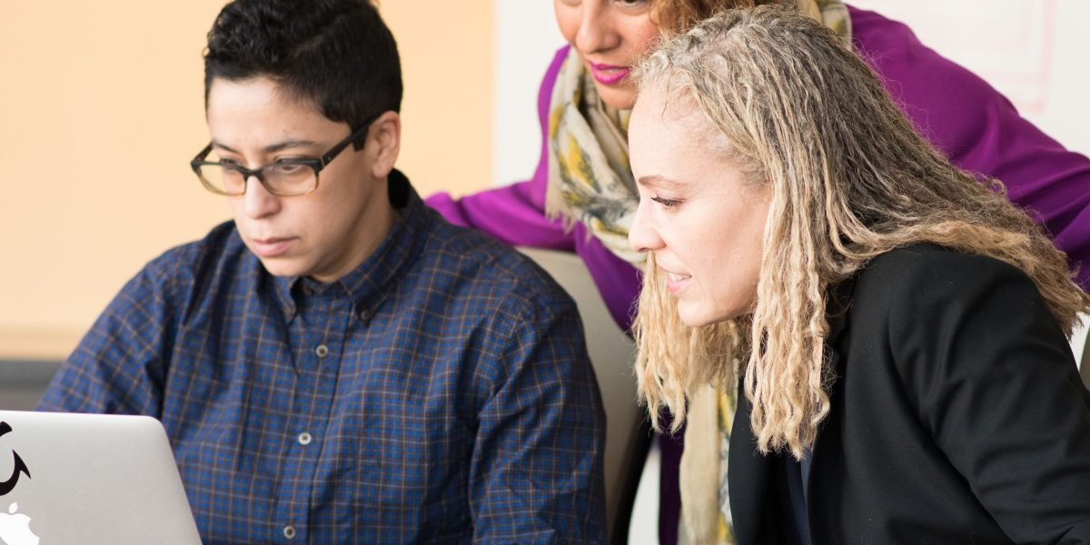 Experienced mentors provide guidance to a young entrepreneur, reflecting the value of strong leadership in investment partnerships.